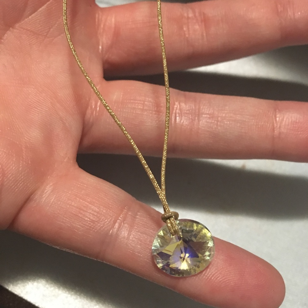 Crystal charm in string necklace